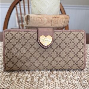 Gucci Diamante Heart canvas continental wallet with beige leather trim.